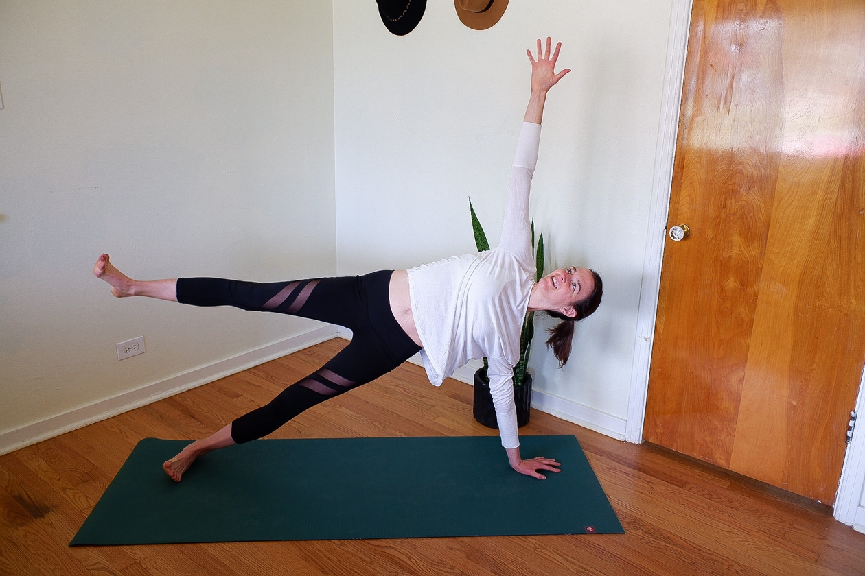 girl flying top leg in side plank