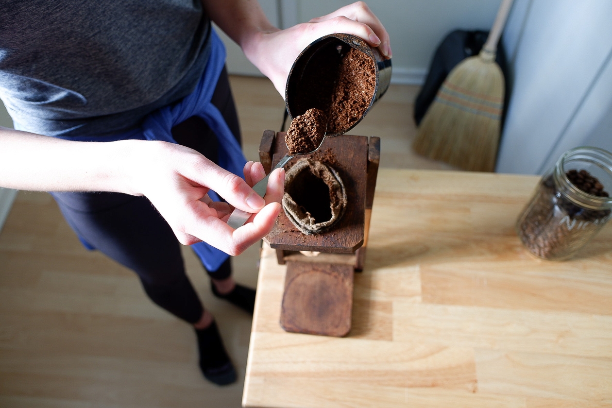 Scooping the coffee grinds